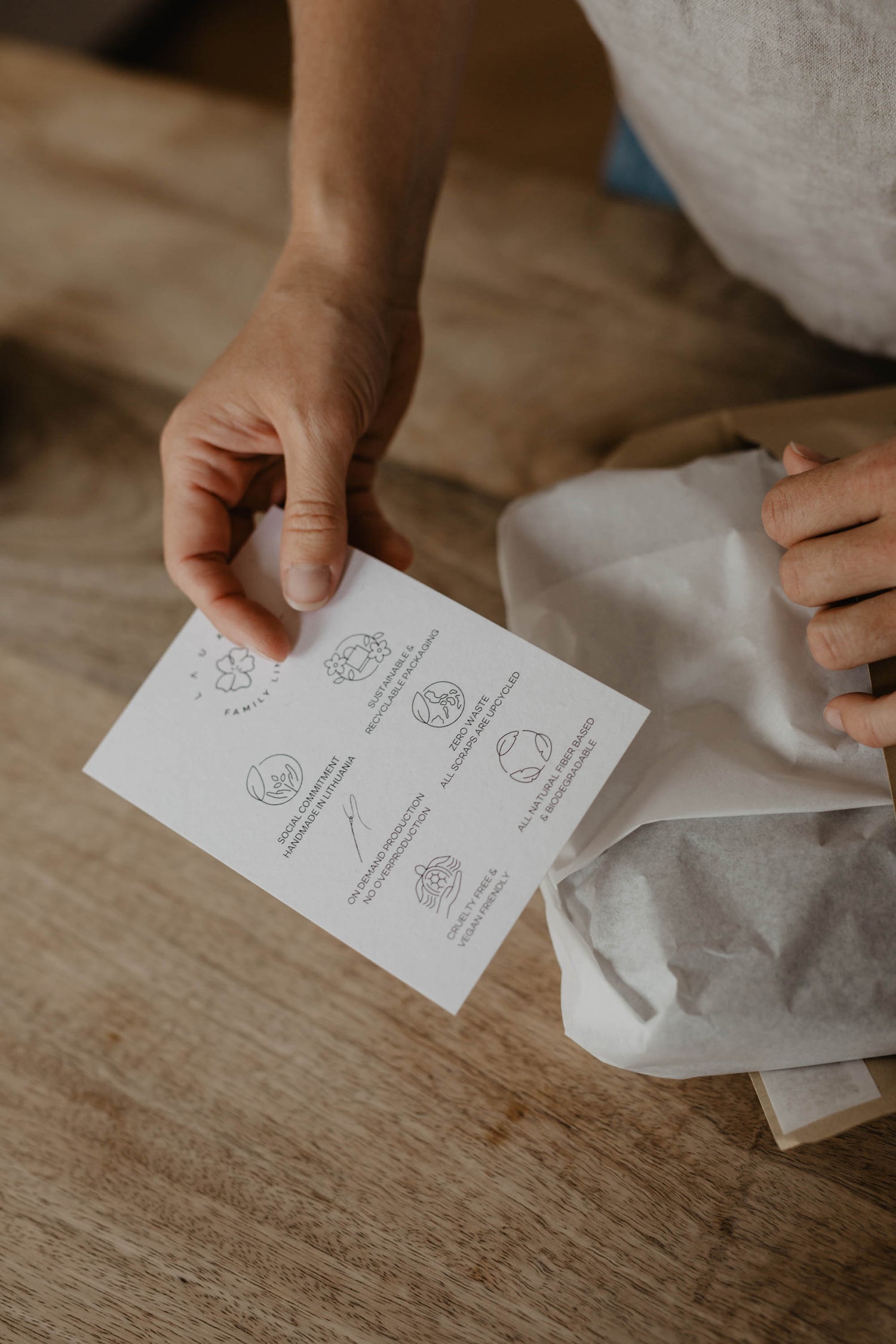 laume linen label being held