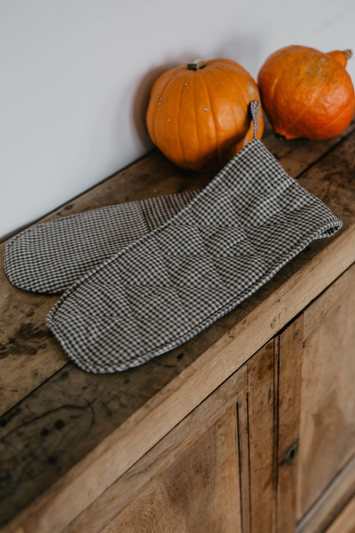 linen double oven mitt on cupboard by laume linen