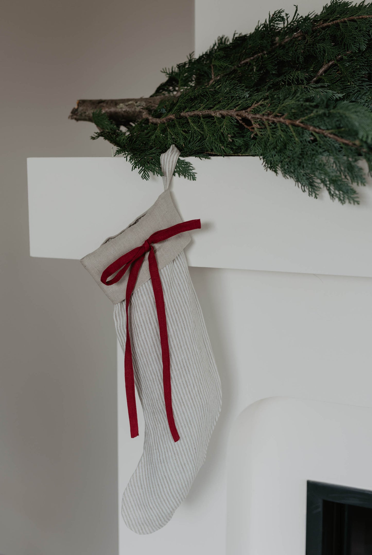 Linen Christmas Stocking with a festive bow detail