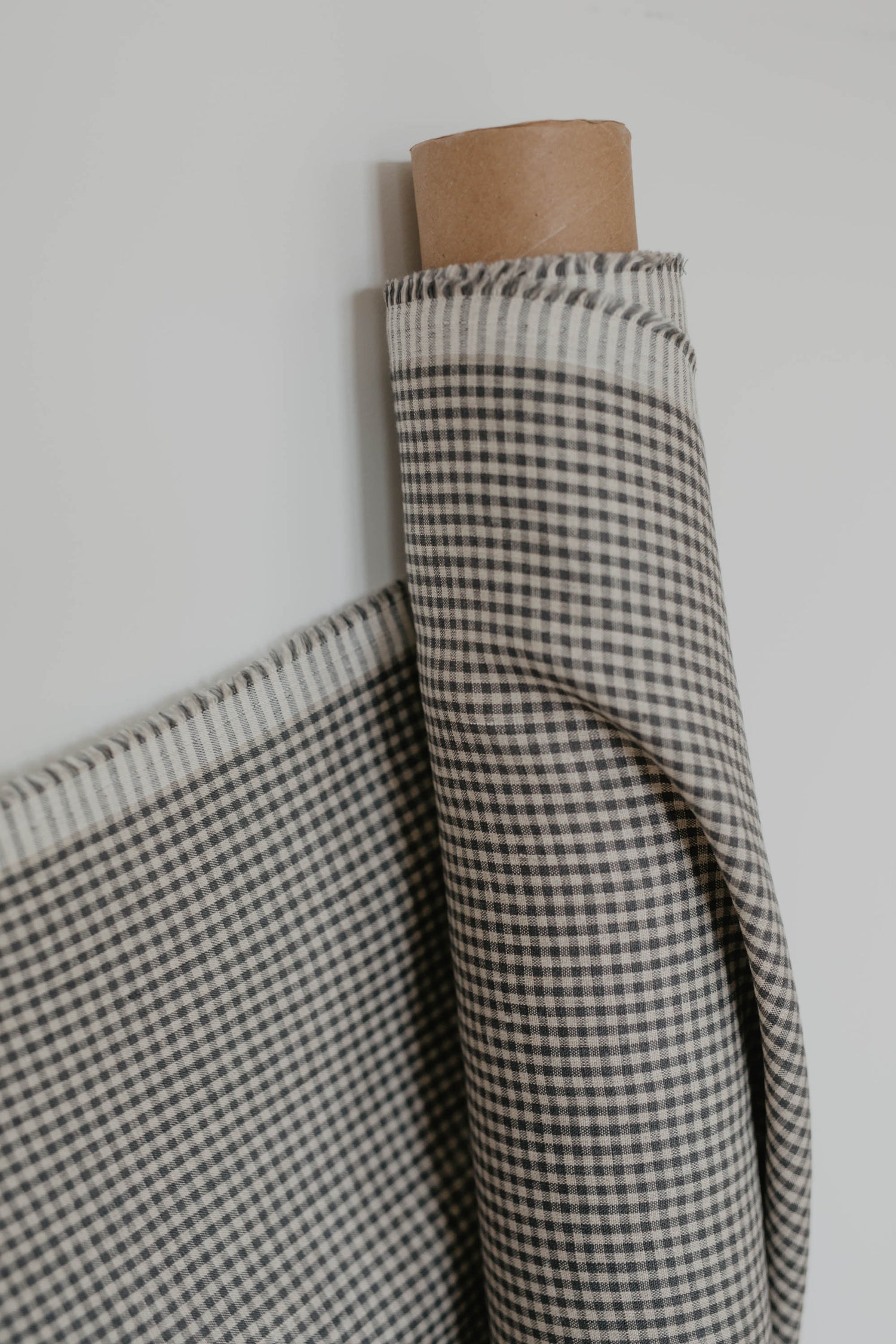 roll of blue check linen fabric