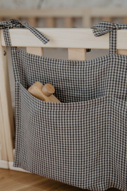 dark blue check linen pocket organiser with toy inside