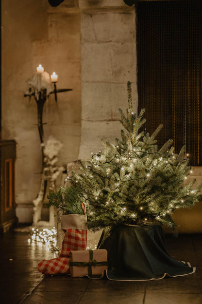 christmas tree with linen wrapped presents