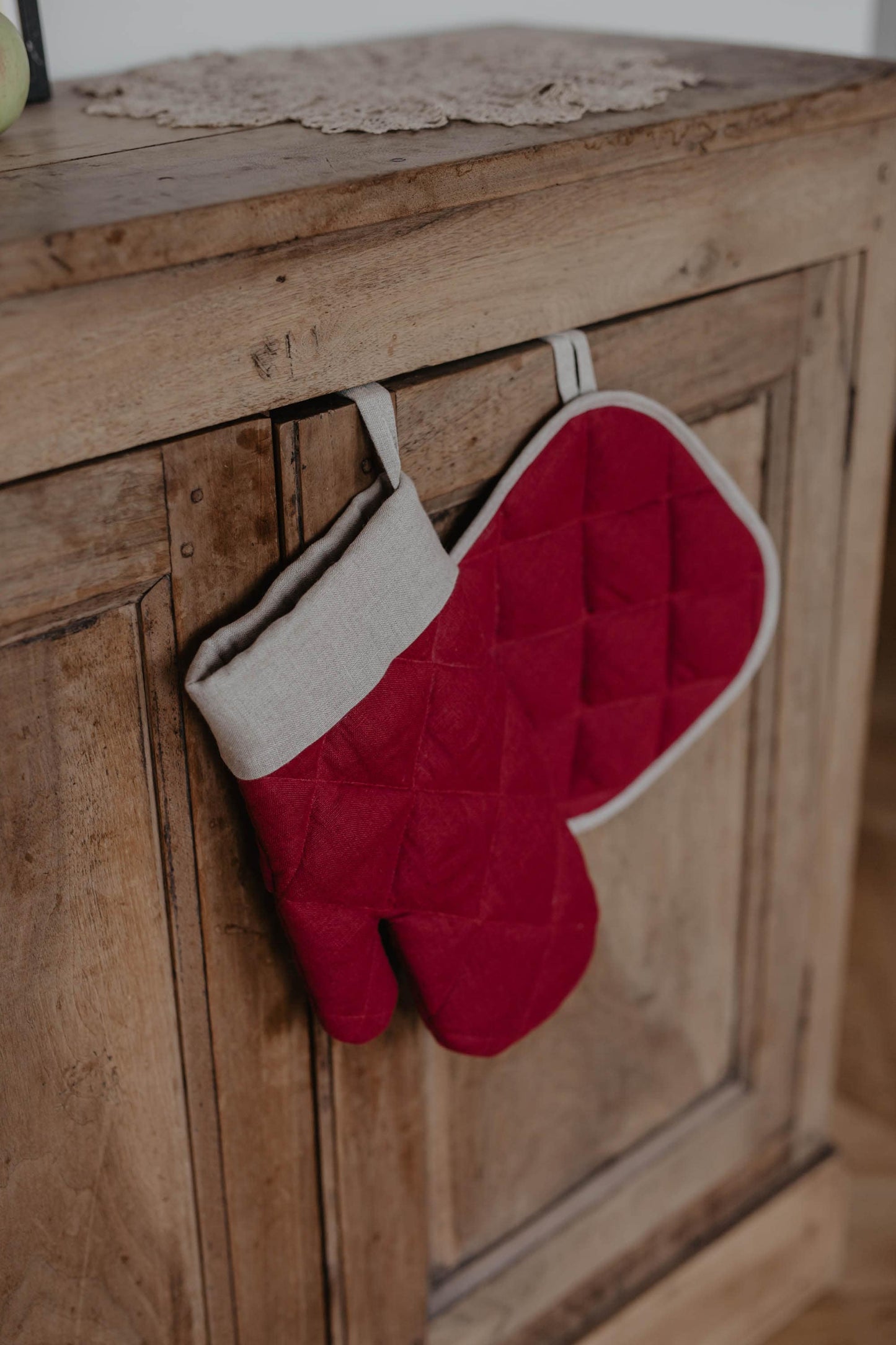 festive linen oven mitt and pot holder in berry red